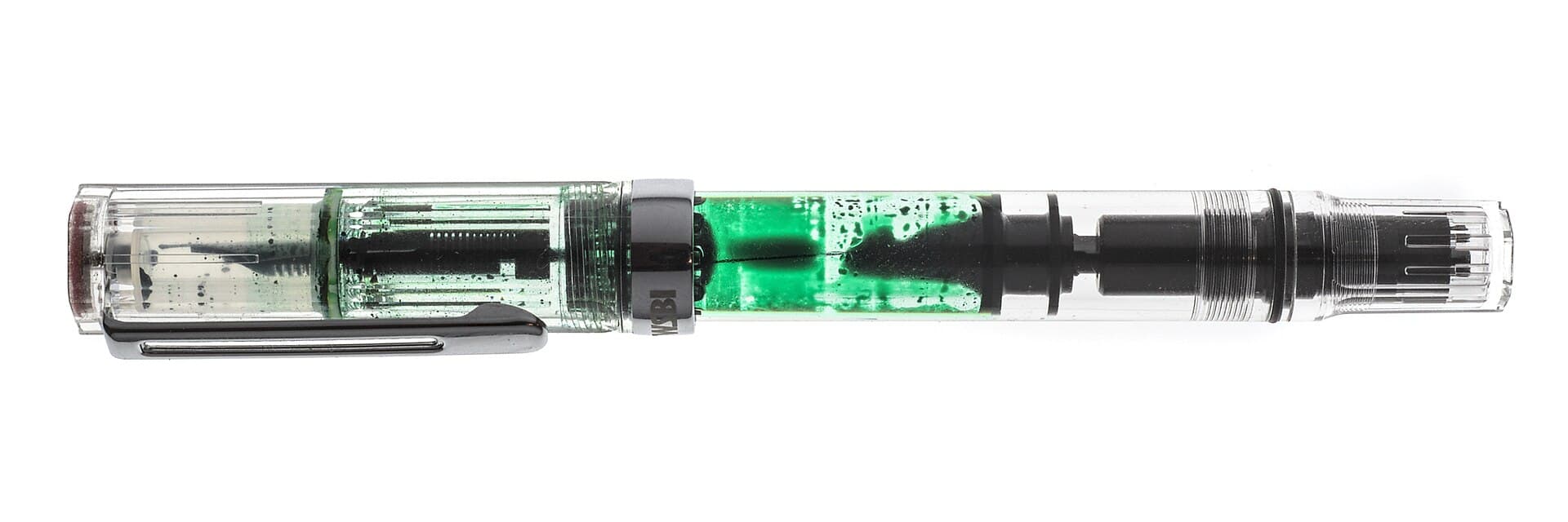 A clear TWSBI Eco fountain pen with its cap beside it